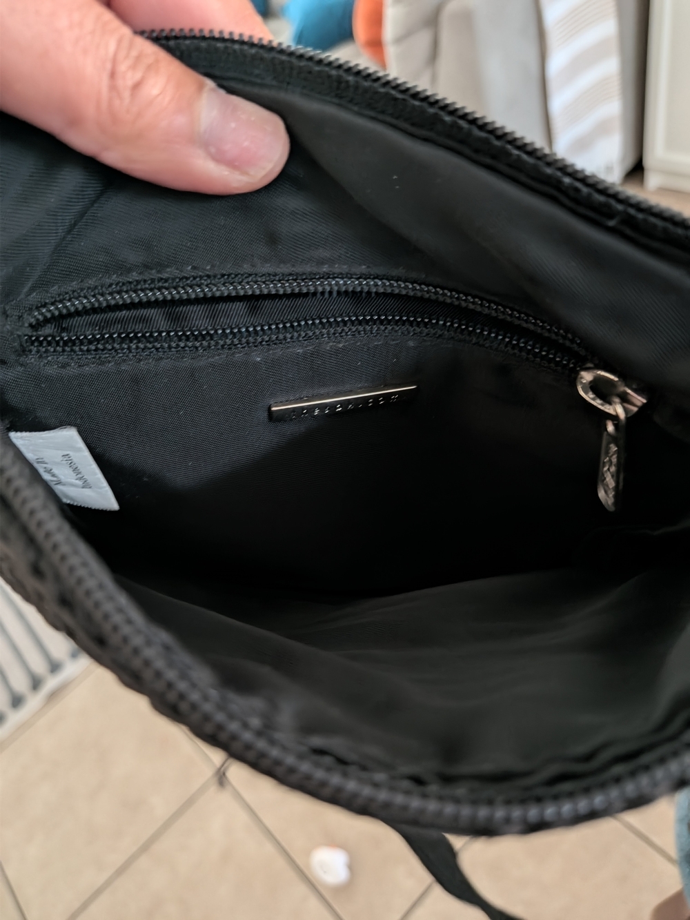The Sak Black Messenger Bag with Branded Metal Accent